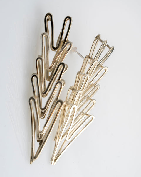 Les boucles d'oreilles Os-coeurs